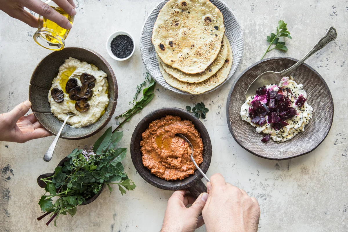 A spread of colourful dips and bread